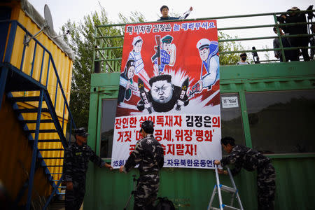 Park Sang-hak, a North Korean defector and leader of an anti-North Korea civic group, prepares to release balloons containing leaflets denouncing North Korean leader Kim Jong Un, near the demilitarized zone in Paju, South Korea, May 5, 2018. REUTERS/Kim Hong-Ji