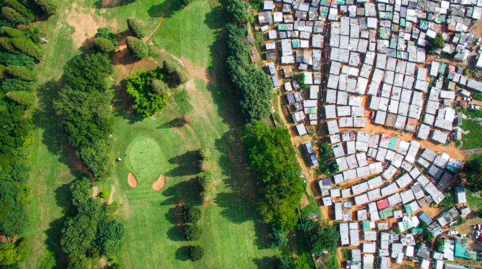 <p>Golfers enjoy a day out close to where people live on the breadline in Ethiopia (MediaiDrumWorld/Johnny Miller) </p>