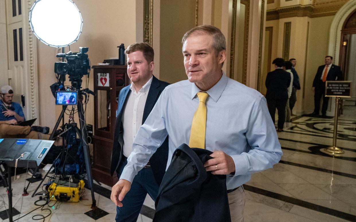 Republican Jim Jordan (right) leaves the House of Representatives following the vote condemning Kamala Harris