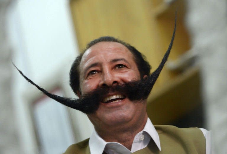 Pakistani businessman Malik Amir Mohammad Khan Afridi has been kidnapped, threatened with death and is forced to live away from his family -- because of his huge moustache, pictured on July 24, 2013. He says his facial hair 'is my life'