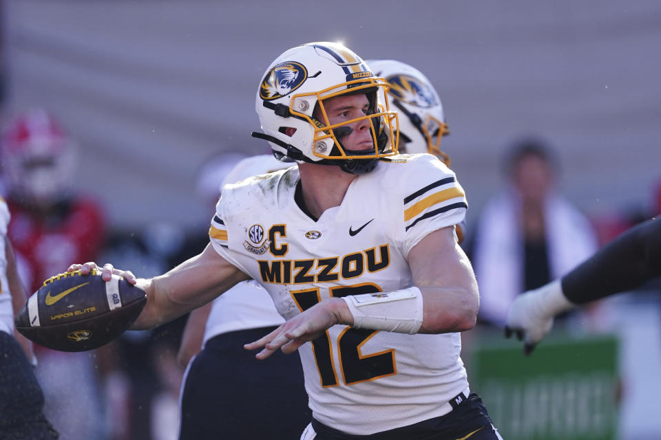 Missouri quarterback Brady Cook (12) throws a pass during the first half of an NCAA college football game against Georgia, Saturday, Nov. 4, 2023, in Athens, Ga. (AP Photo/John Bazemore)