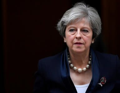 FILE PHOTO: Britain's Prime Minister Theresa May leaves 10 Downing Street in London, November 1, 2017. REUTERS/Toby Melville /File Photo