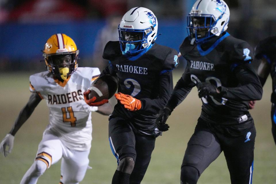 Hardley Gilmore (2) of Pahokee returns an interception for a touchdown during the first half of a high school football game at Pahokee High School in Pahokee, Florida, Nov. 3, 2023.