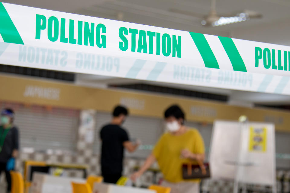 People seen voting at Chung Cheng High School on 10 July. (PHOTO: Dhany Osman / Yahoo News Singapore)