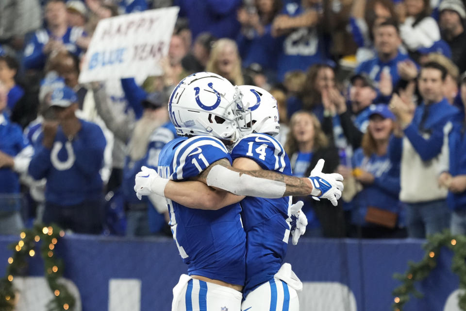 Indianapolis Colts wide receiver Alec Pierce (14) celebrates his touchdown catch with wide receiver Michael Pittman Jr. (11) during the first half of an NFL football game against the Las Vegas Raiders, Sunday, Dec. 31, 2023, in Indianapolis. (AP Photo/AJ Mast)