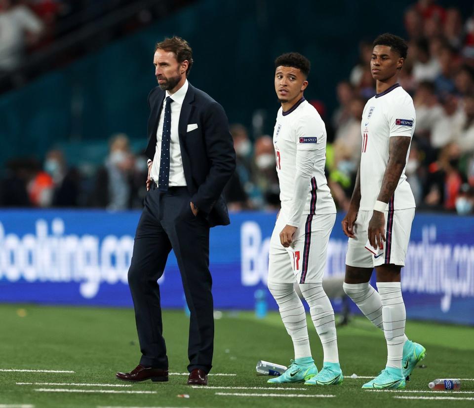 london, england   july 11 jadon sancho and marcus rashford of england prepare to come on as substitutes as gareth southgate, head coach of england looks on during the uefa euro 2020 championship final between italy and england at wembley stadium on july 11, 2021 in london, england photo by eddie keogh   the fathe fa via getty images