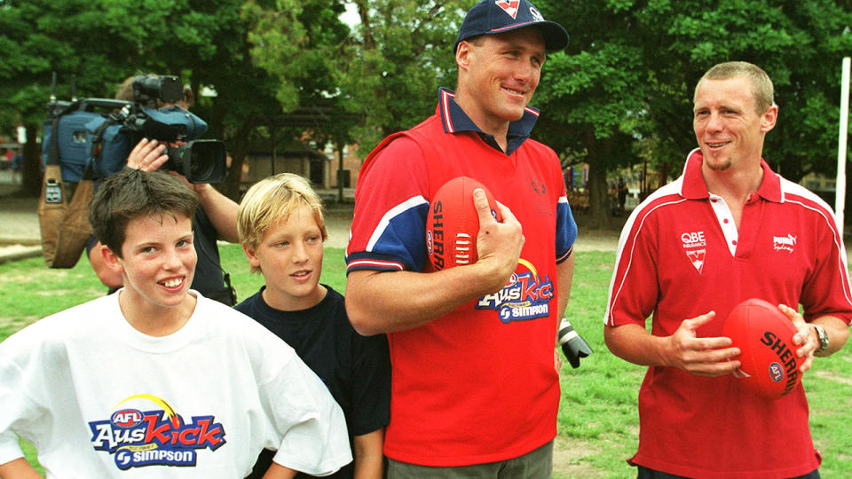 Tony Lockett and Stuart Maxfield, pictured here during an Auskick launch.