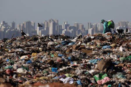 A man works at 'Lixao da Estrutural', Latin America's largest rubbish dump, in Brasilia, Brazil, January 19, 2018. REUTERS/Ueslei Marcelino