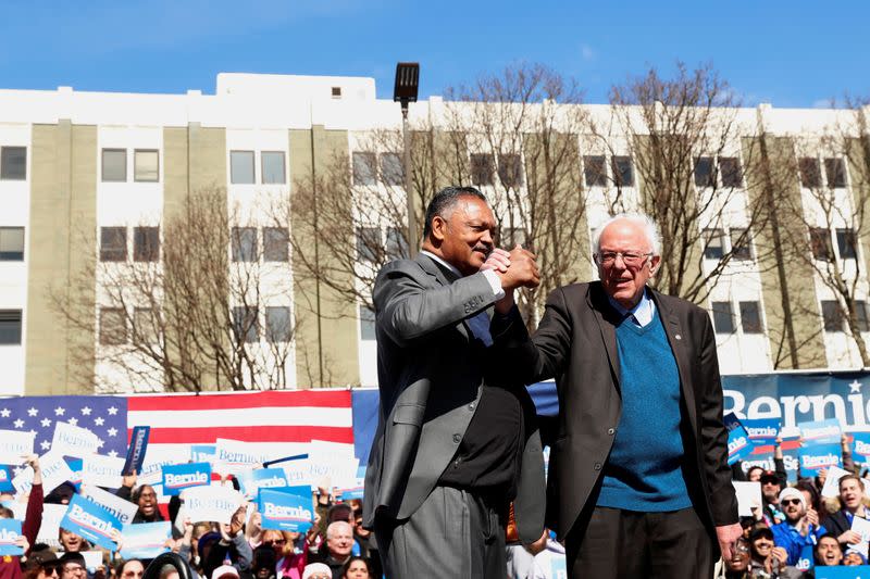 Civil rights activist Reverend Jesse Jackson stands on stage after endorsing U.S. Democratic presidential candidate Bernie Sanders at a rally in Grand Rapids, Michigan