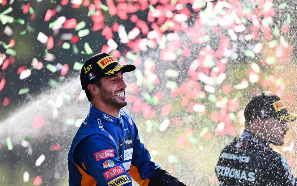 Race winner Daniel Ricciardo of Australia and McLaren F1 celebrates with sparkling wine on the podium during the F1 Grand Prix of Italy at Autodromo di Monza on September 12, 2021 in Monza, Italy - Clive Mason - Formula 1/Formula 1 via Getty Images