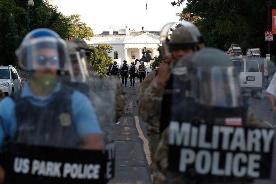 FILE - In this Monday, June 1, 2020, file photo police clear the area around Lafayette Park and the White House in Washington, as demonstrators gather to protest the death of George Floyd, a black man who died after being restrained by Minneapolis police officers last month. The violent clearing of demonstrators from the nation's premier protest space in front of the White House is spotlighting a tiny federal watch force created by George Washington. Democratic lawmakers want answers about the clubbing, punching and other force deployed by some Park Police in routing protesters from the front of the White House on Monday.  (AP Photo/Alex Brandon, File)