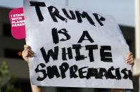 <p>A protester holds up a sign during a rally opposing the nomination of Judge Brett Kavanaugh to the U.S. Supreme Court, Tuesday, July 10, 2018, in Jackson, Miss. (Photo: Rogelio V. Solis/AP) </p>