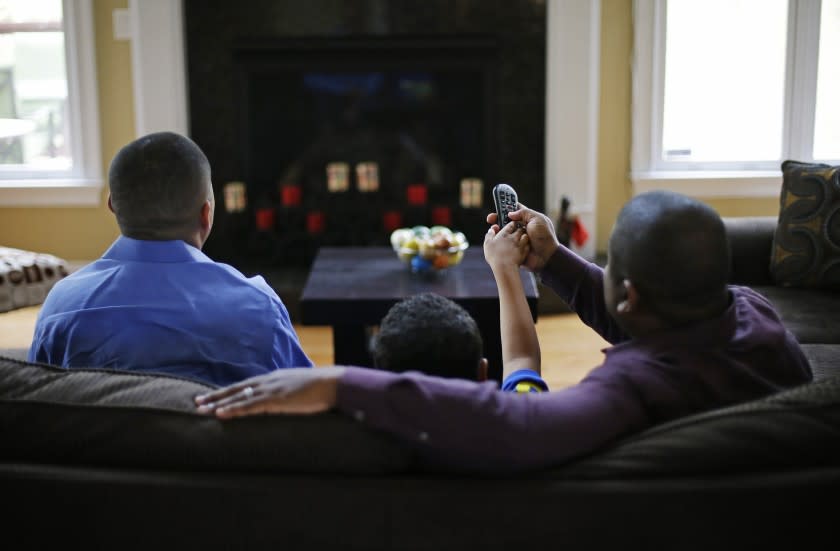 Family watching tv