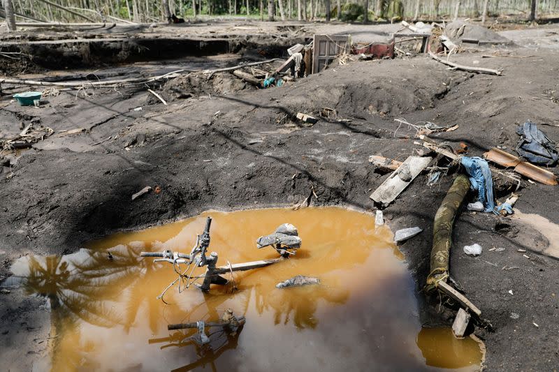 Bicycles are seen submerged following the Mount Semeru volcano eruption in Sumberwuluh, Candipuro district, Lumajang