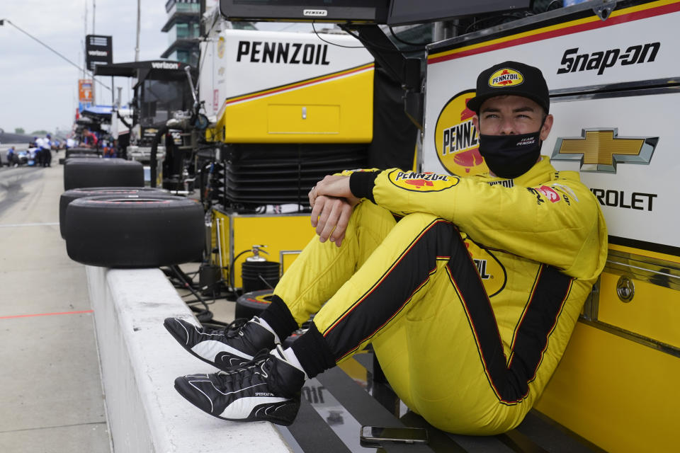 Scott McLaughlin, of New Zealand, waits by his pit box during practice for the Indianapolis 500 auto race at Indianapolis Motor Speedway, Wednesday, May 19, 2021, in Indianapolis. (AP Photo/Darron Cummings)