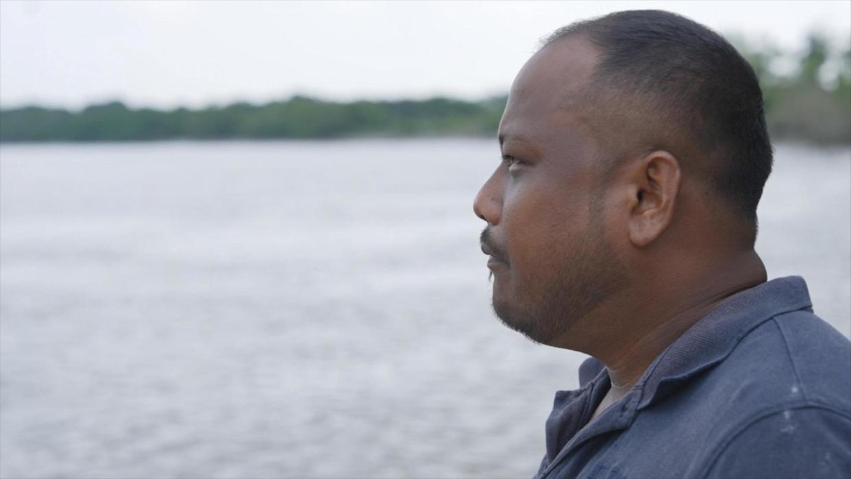 PHOTO: Local fisherman Saravanan Kumar told ABC News that the facility where a plastic bag tracker is regularly discharging plastic laden waste water into the river his family has relied on for generations. (ABC News)