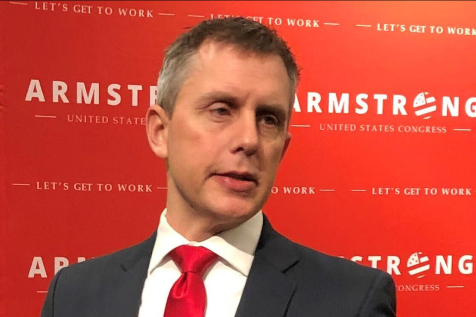 FILE - Republican U.S. Rep. Kelly Armstrong talks with supporters after announcing his re-election bid on Monday, Feb. 17, 2020, in Fargo, N.D. Armstrong is seeking his second term in Congress. (AP Photo/Dave Kolpack, File)