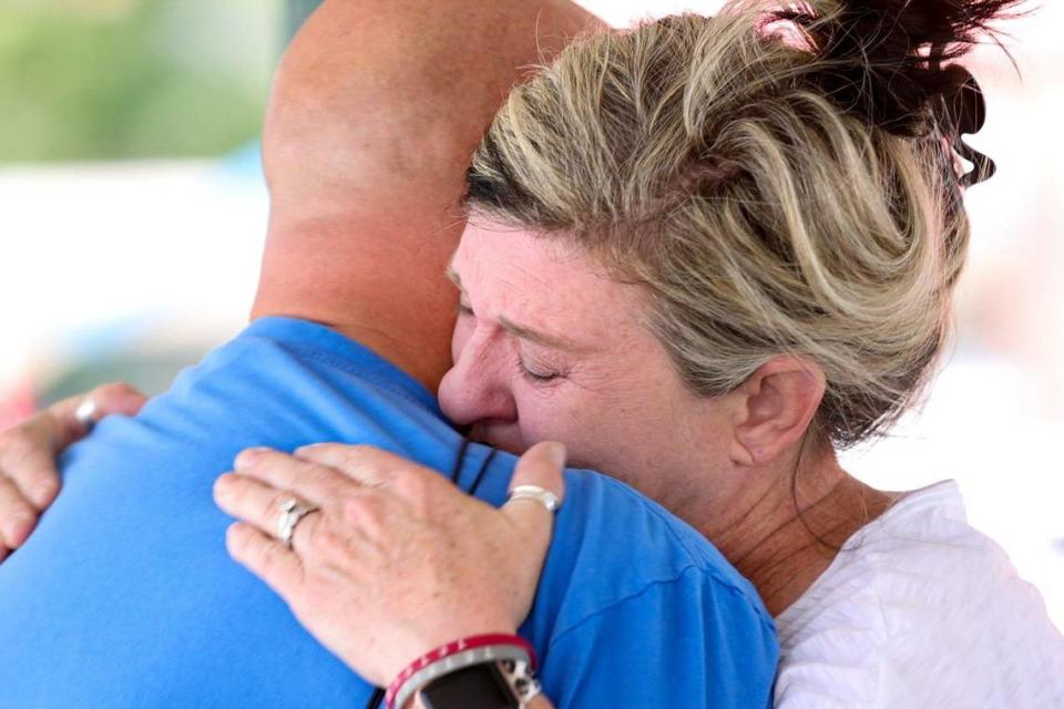 Former co-owner of Parkette Drive-In Randy Kaplan, left, embraced someone Wednesday after the closure of the restaurant on Tuesday. Several employees did not get the word that the Parkette had closed and showed up for their lunch shifts.