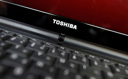 FILE PHOTO: Toshiba Corp's logo is pictured on a computer displayed at an electronic store in Tokyo May 8, 2012. REUTERS/Yuriko Nakao/File Photo