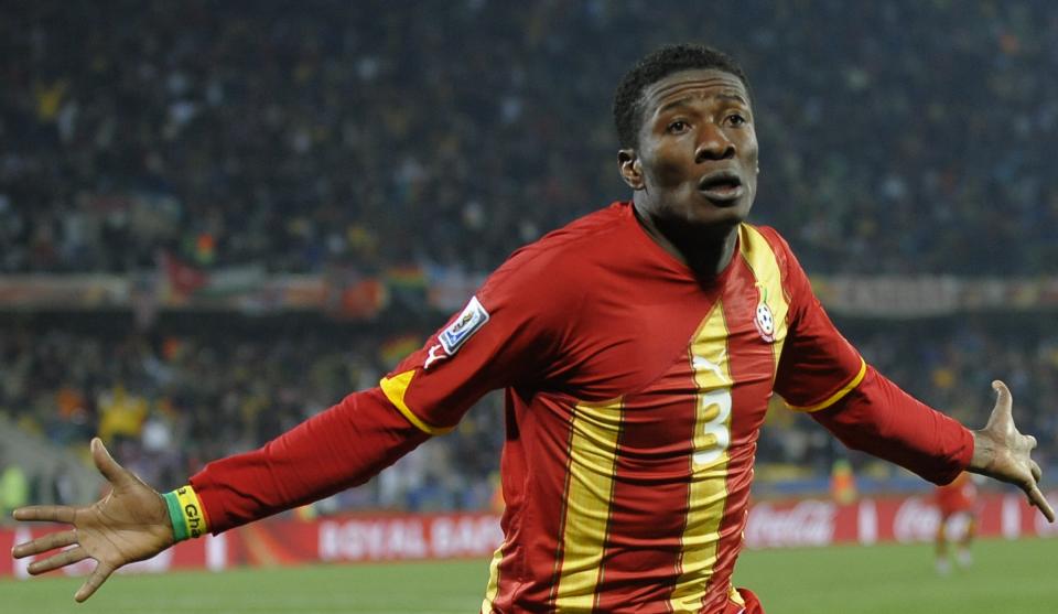 Ghana's striker Asamoah Gyan celebrates after scoring against the USA during extra time of their 2010 World Cup round of 16 football match at Royal Bafokeng stadium in Rustenburg, South Africa, on June 26, 2010.  NO PUSH TO MOBILE / MOBILE USE SOLELY WITHIN EDITORIAL ARTICLE   -    AFP PHOTO / TIMOTHY A. CLARY (Photo credit should read TIMOTHY A. CLARY/AFP via Getty Images)