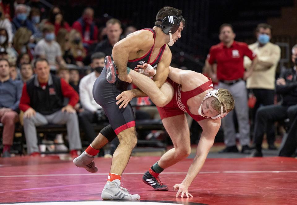 Rutgers' 141-pounder Sebastian Rivera, shown wrestling Indiana's Cayden Rooks on Jan. 7,  is completely healthy after a knee injury he sustained Feb. 18 against Princeton, Rutgers coach Scott Goodale said.