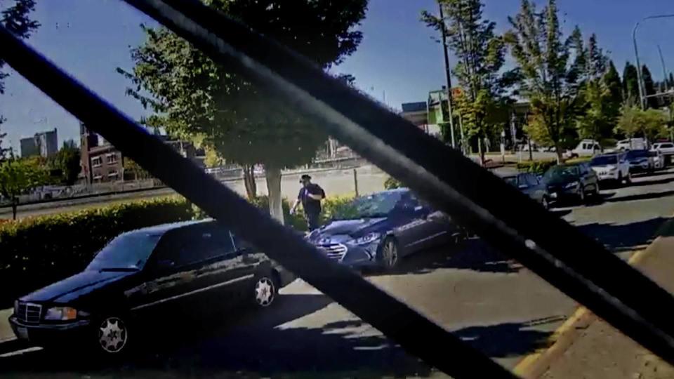 On Aug. 28, 2020, police found Kassanndra's car parked on a street in an industrial neighborhood; it was unlocked, with the keys on the center console. A light rail system operated along that same street, so investigators requested its train camera footage from Aug. 25. One video showed a man in a dark hat walking away from Kasssanndra's car and continuing to the nearby light rail station around 11:50 that morning.  / Credit: Pierce County Sheriff's Department