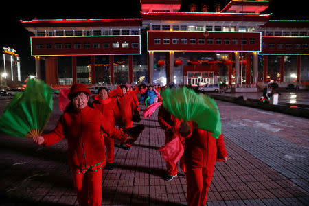 Women participate in a group dance exercise close to the Yalu River which runs between China and North Korea, in the town of Linjiang in Jilin province, China, November 21, 2017. REUTERS/Damir Sagolj