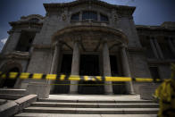Caution tape blocks off access to the Bellas Artes Palace despite the easing of COVID-19 related restrictions, in downtown Mexico City, Friday, July 3, 2020. Limited reopening of restaurants and other businesses in the capital this week came as new coronavirus cases continued to climb steadily. (AP Photo/Fernando Llano)