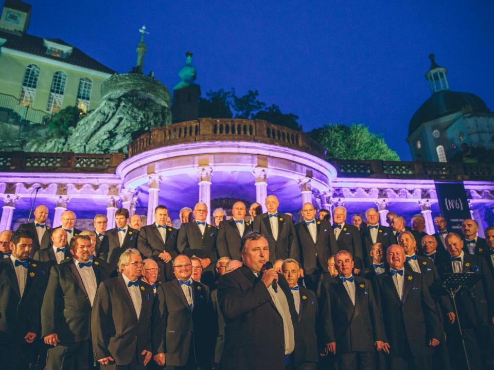 The 70-strong Brythoniaid Male Voice Choir in the village's piazza (Lucy Whitehead)