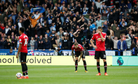Soccer Football - Premier League - Huddersfield Town vs Manchester United - John Smith's Stadium, Huddersfield, Britain - October 21, 2017 Manchester United's Nemanja Matic and Victor Lindelof look dejected after conceding the second goal REUTERS/Andrew Yates