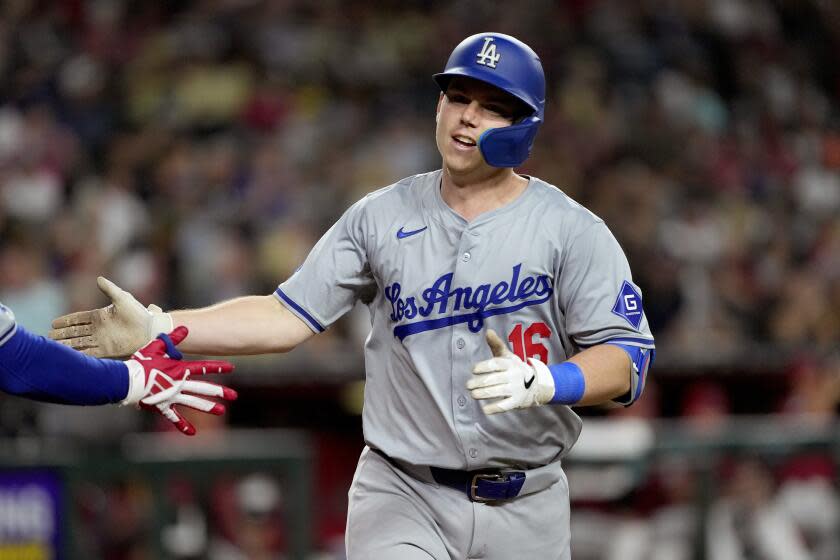 Los Angeles Dodgers' Will Smith crosses the plate after hitting a solo home run.