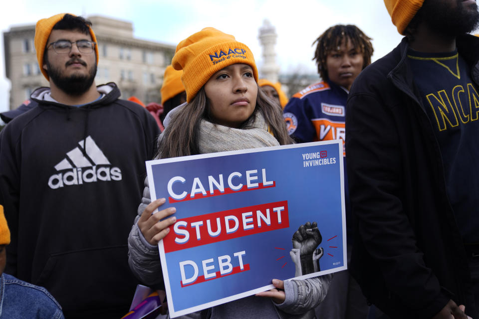 Student debt relief advocates gather outside the Supreme Court on Capitol Hill in Washington, Tuesday, Feb. 28, 2023.. Arguments at the Supreme Court over President Joe Biden's student debt cancellation left some borrowers feeling isolated as they heard such a personal subject reduced to cold legal language. (AP Photo/Patrick Semansky)