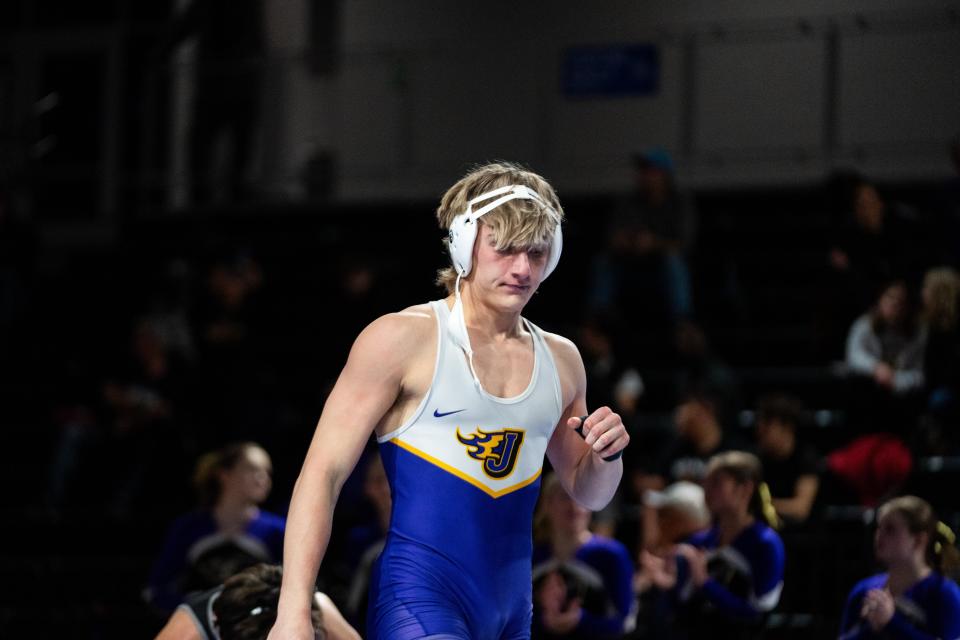 Johnston senior Braden Blackorby walks off the mat after his victory against Waukee Northwest on Dec. 7 in Waukee. Blackorby is wrestling at 175 pounds this season after finishing second in the state at 145 as a junior.