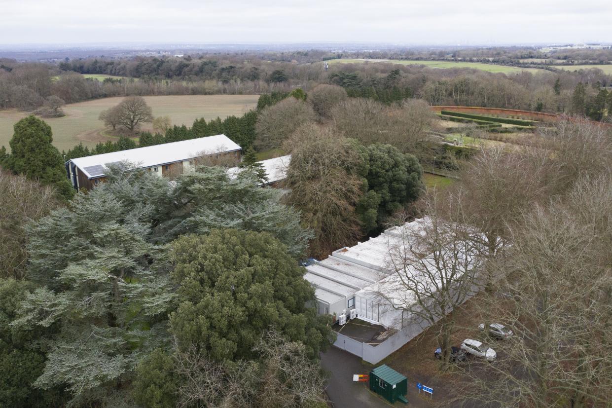 A temporary mortuary is set up on the grounds of Headley Court on Jan. 11, 2021, in Leatherhead, England. In the first wave of the pandemic, local authorities across the UK built temporary morgue structures in anticipation of hospital morgues reaching capacity. Many worst-case scenarios were never realized, but the number of covid-related deaths has started to rise again with the latest surge.