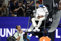 Daniil Medvedev of Russia gestures as he argues with chair umpire Jaume Campistol during a break in his semifinal against Stefanos Tsitsipas of Greece at the Australian Open tennis championships in Melbourne, Australia, Friday, Jan. 28, 2022. (AP Photo/Hamish Blair)