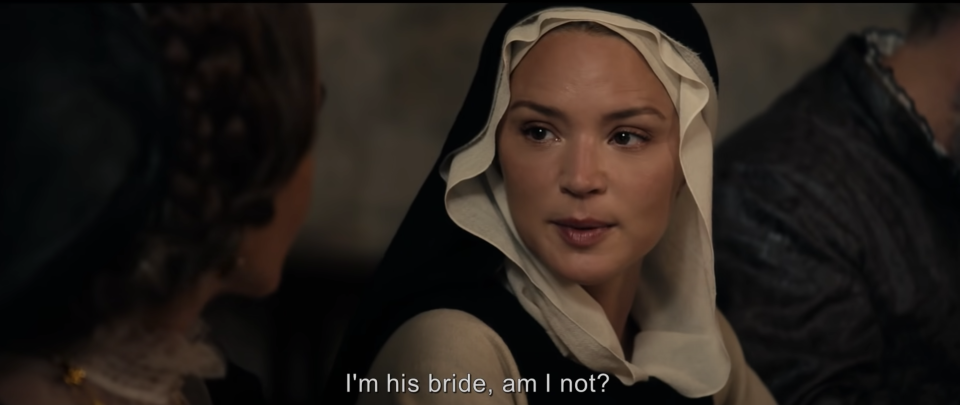 A woman wearing a nun's habit asks "I'm his bride, am I not?"