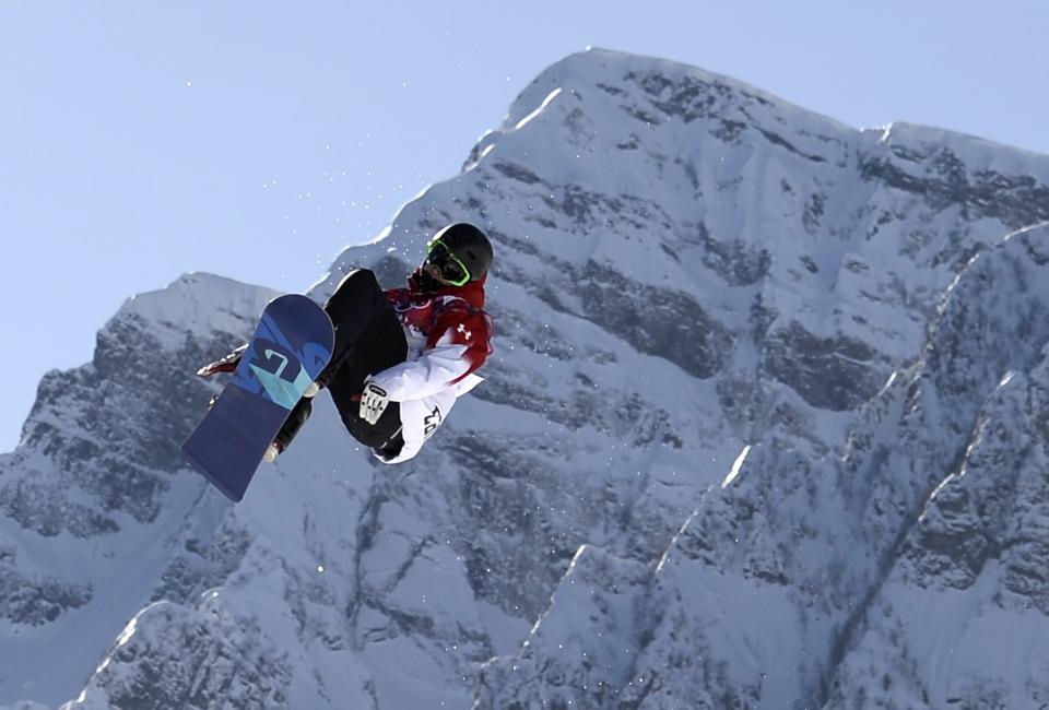 Canada's Maxence Parrot performs a jump during the men's snowboard slopestyle qualifying session at the 2014 Sochi Olympic Games in Rosa Khutor February 6, 2014. Parrot blazed into Saturday's final of the men's slopestyle event on Thursday and said he was confident Canada could still make a clean sweep of the medals despite injury worries. REUTERS/Dylan Martinez (RUSSIA - Tags: OLYMPICS SPORT SNOWBOARDING TPX IMAGES OF THE DAY)