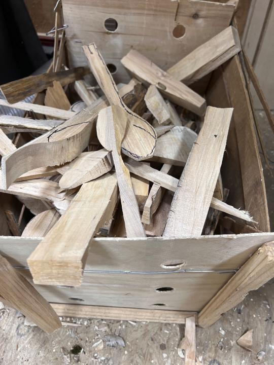 This photo taken on June 5, 2022 shows a pile of wood debris that was rejected for spoon carving. Many people have turned to crafts to relieve stress during the pandemic. Woodcarvers are among those who say they find a meditative quality in their work. They find satisfaction in doing something creative and using a medium that comes from nature. (Tracee M. Herbaugh via AP)