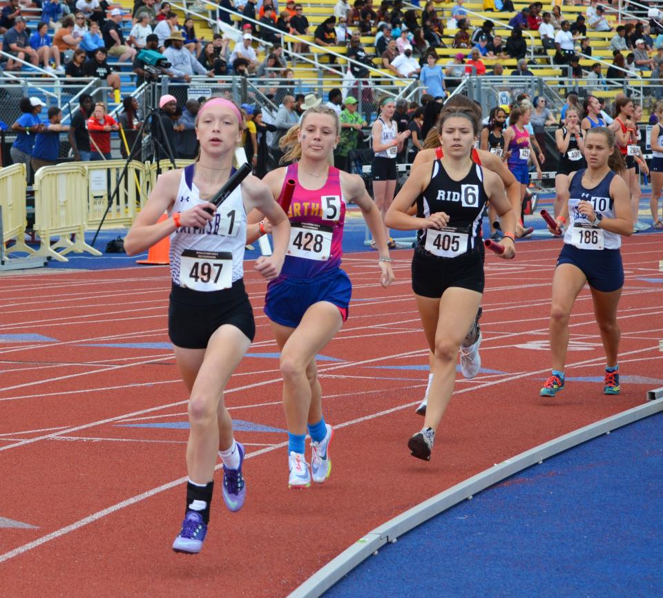 Smithsburg's Grace Ellis leads the Class 1A girls 4x800 relay during the opening leg.