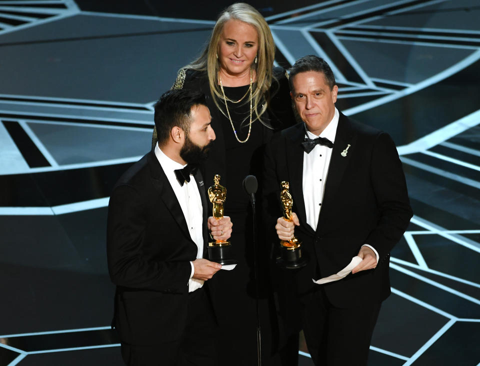 Filmmakers Adrian Molina, Darla K. Anderson and Lee Unkrich accept Best Animated Feature Film for 'Coco' onstage during the 90th Annual Academy Awards at the Dolby Theatre at Hollywood & Highland Center on March 4, 2018 in Hollywood.