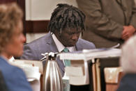 Emanuel Kidega Samson sits in court as the verdict is read in his murder trial Friday, May 24, 2019, in Nashville, Tenn. Samson was found guilty of first-degree murder in a shooting at a Nashville church two years ago that left a woman dead and seven wounded. Jurors deliberated less than five hours before finding Samson guilty on all 43 counts in the indictment. (Shelley Mays/The Tennessean via AP, Pool)