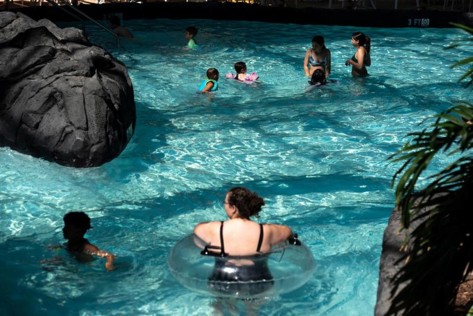 Guests swim in the pool at OWA’s Tropic Falls water park in Foley, Alabama.