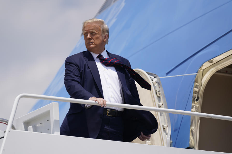 President Donald Trump boards Air Force One for a trip to visit Bioprocess Innovation Center at Fujifilm Diosynth Biotechnologies in Morrisville, N.C., Monday, July 27, 2020, in Washington. President Trump’s lawyers filed fresh arguments Monday to try to block or severely limit a criminal subpoena for his tax records, calling it harassment of the president. Lawyers filed a rewritten lawsuit in Manhattan federal court to challenge the subpoena by Manhattan's state prosecutor on grounds they believe conform with how the U.S. Supreme Court said the subpoena can be contested. (AP Photo/Evan Vucci)