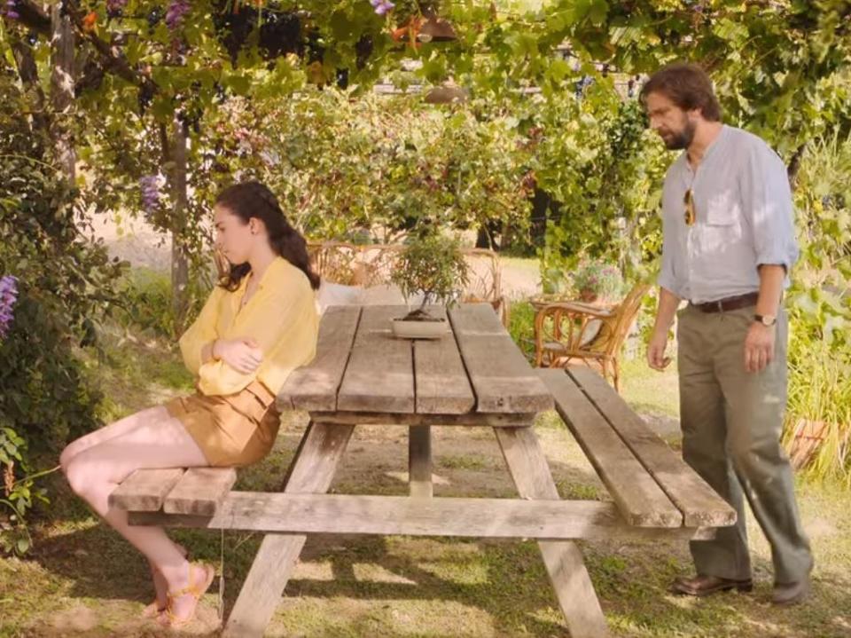 lina and howard around a picnic table in love and gelato