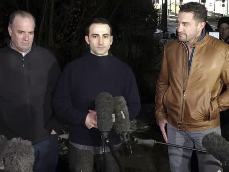 Amir Hekmati (centre), flanked by U.S. Congressman Dan Kildee (L) and brother-in-law Ramy Kurdi, speaks with media in Landstuhl, Germany January 19, 2016 for the first time since his release. REUTERS/Hakan Erdem