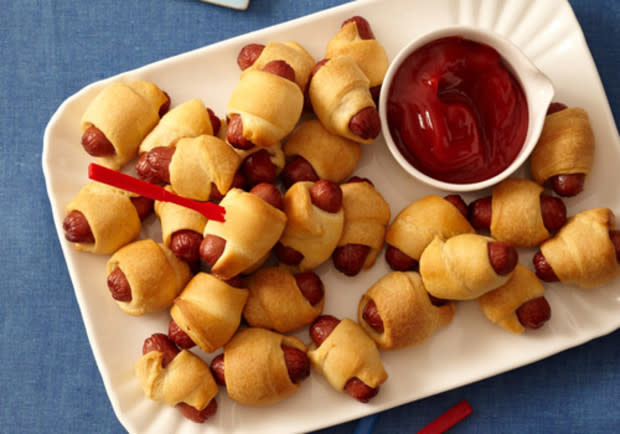 <p>George Duran</p><p>Kids will love coming home to their own little party appetizer. </p><p><strong>Get the recipe: <a href="https://parade.com/29977/sheilalukins/pigs-in-a-blanket/" rel="nofollow noopener" target="_blank" data-ylk="slk:Pigs-in-a-Blanket;elm:context_link;itc:0;sec:content-canvas" class="link ">Pigs-in-a-Blanket</a></strong></p>