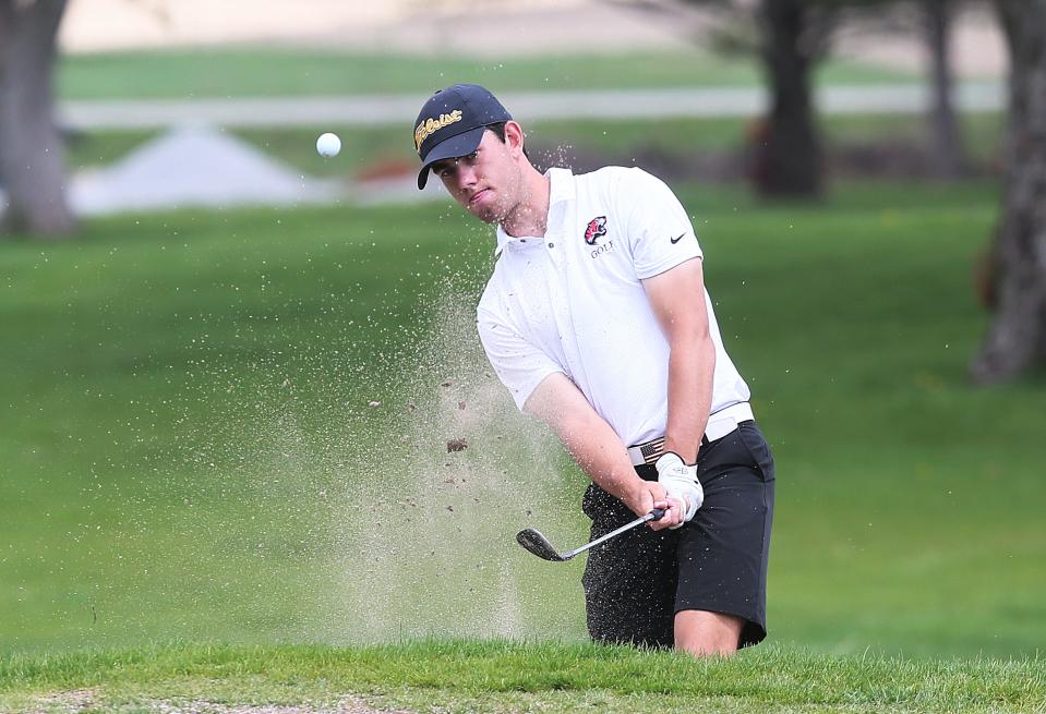 Gilbert's Brock Snyder looks at the ball after a bunker shot onto the 15th green during the Raccoon River Conference boys golf meet at the Ames Golf and Country Club Monday.  Snyder shot a 68 over 18 holes to win medalist honors and Gilbert took the team title with a score of 292.