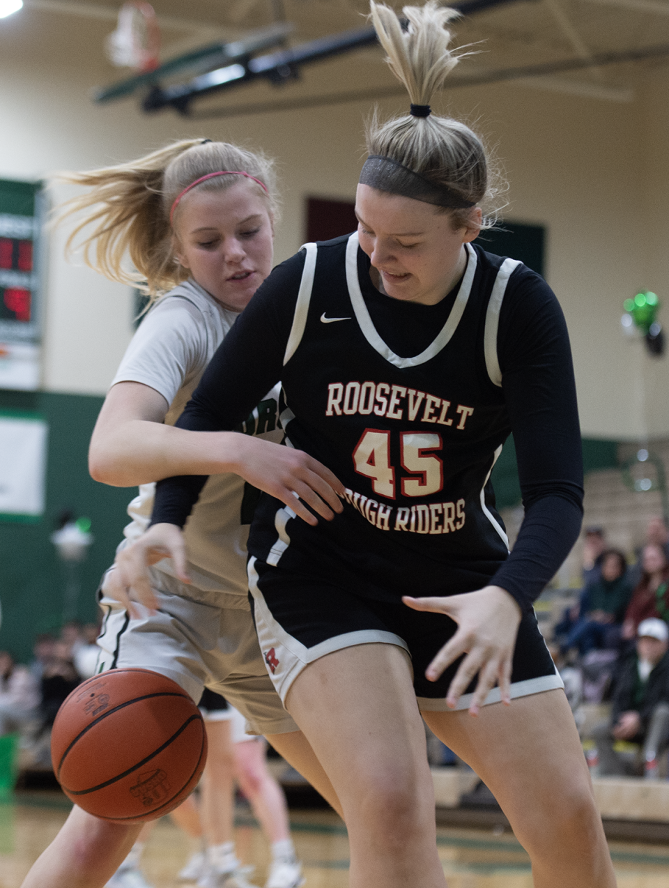 Julia Miller and Lexi Canning after a rebound. Aurora hosted Kent Roosevelt on Saturday, February 4.