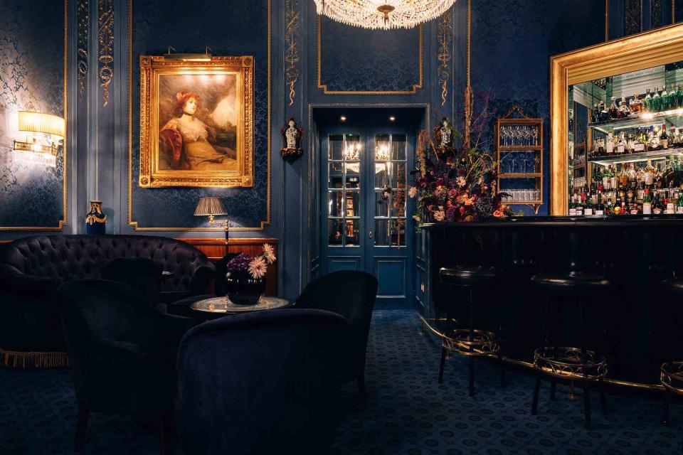 <p>Courtesy of Hotel Sacher</p> The decadent Blaue Bar, at Hotel Sacher Vienna, is furnished with crystal chandeliers and brocade walls.