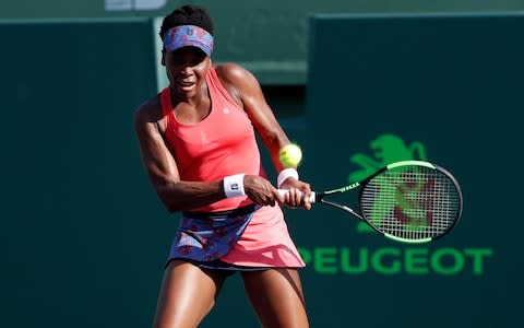 Venus Williams of the United States hits a backhand against Johanna Konta of Great Britain (not pictured) on day seven of the Miami Open at Tennis Center at Crandon Park - Credit: USA TODAY Sports